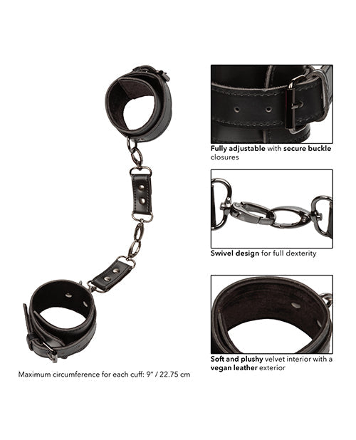 Black hand cuffs with adjustable buckle closures and linked chain detail