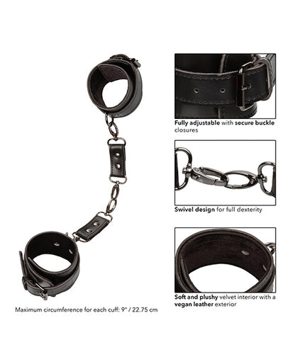 Black hand cuffs with adjustable buckle closures and linked chain detail
